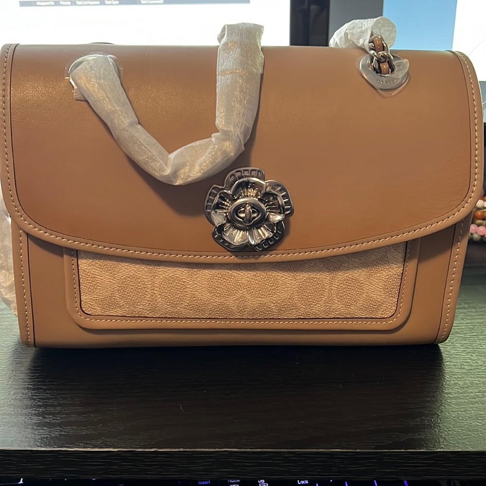Tan and cream Coach purse with dust bag.